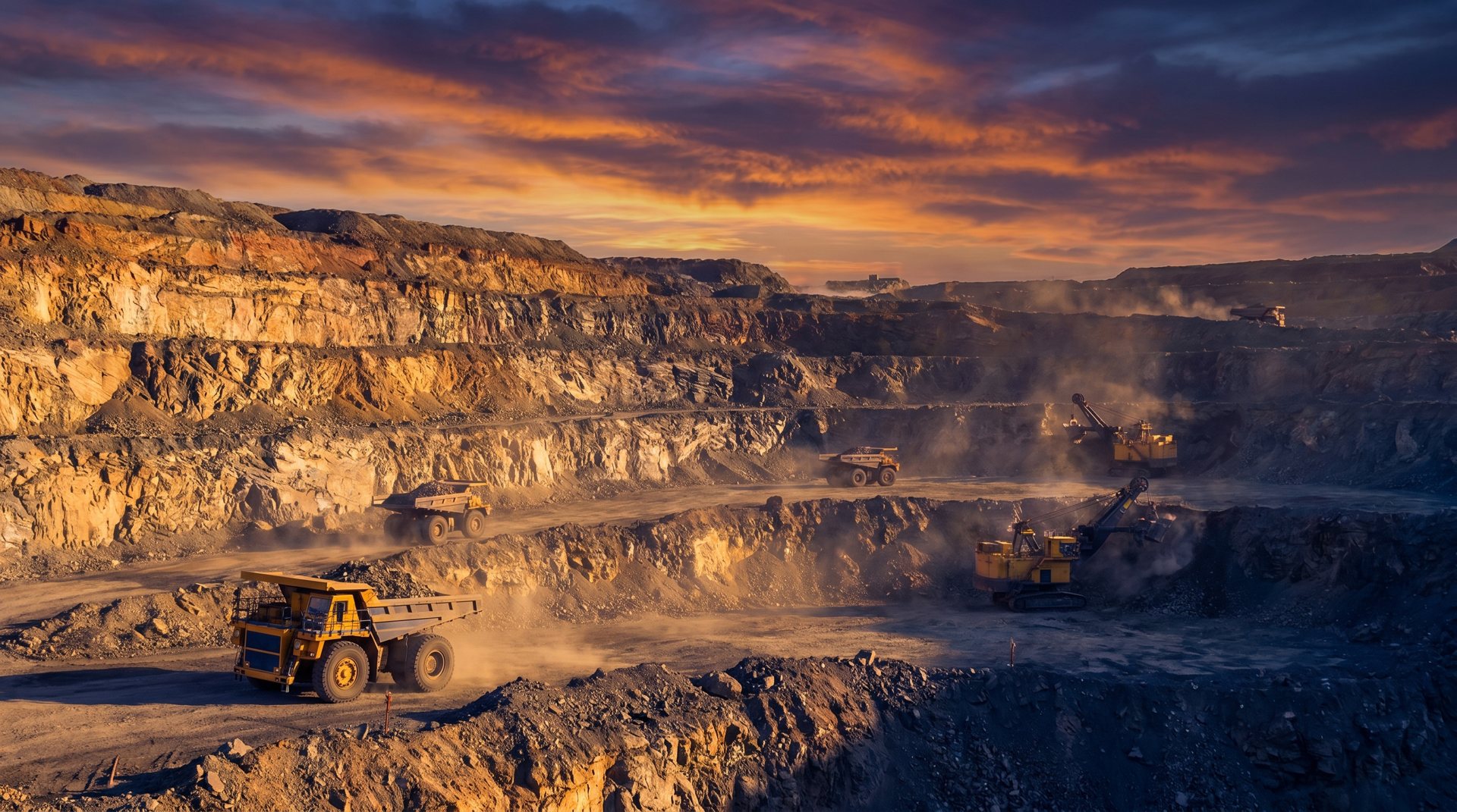 Open-pit mining operation at golden hour